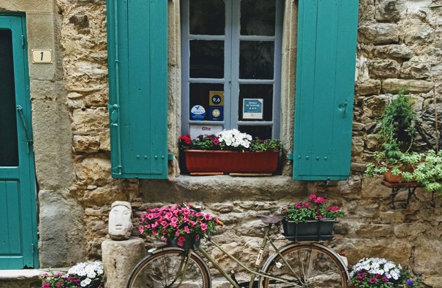 Typical stone house, in a small cobbled street, behind the chateau of Cesseras.