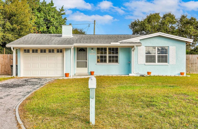 Updated home on a corner lot with a private pool - short drive to the beach