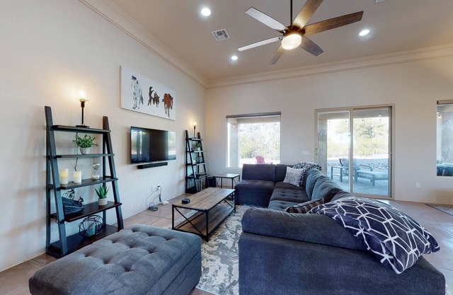 Updated home with mountain views, a private patio, grill, EV charger, W/D, & AC
