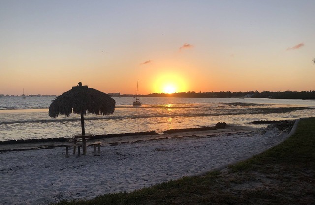 Upgraded Waterfront Condo Steps Away From Private Beach with Spectacular Sunsets