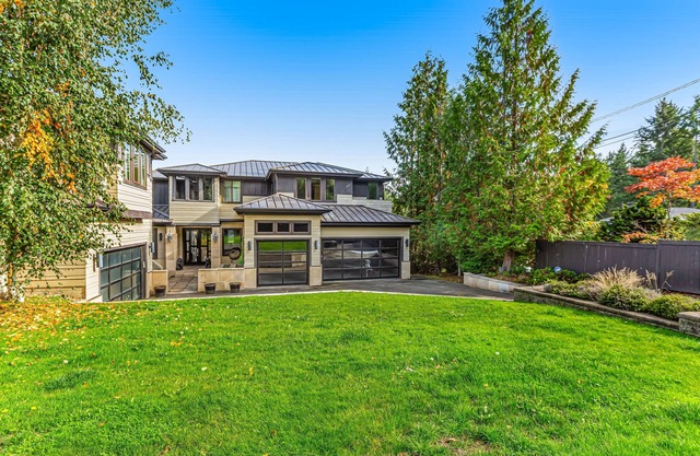 Upscale waterfront estate with private dock, fireplace, & gourmet kitchen