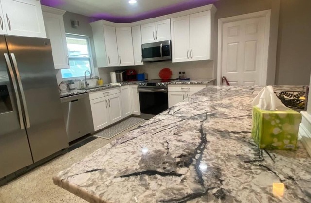 Vacation unheated spillover pool home close to beach