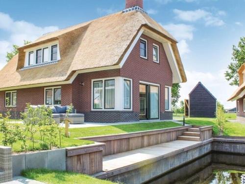 Villa in Friesland with Waterfront Jetty