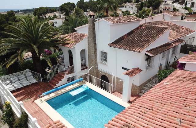 Villa with heated pool, beaches and town 10 mins walk, small sea view