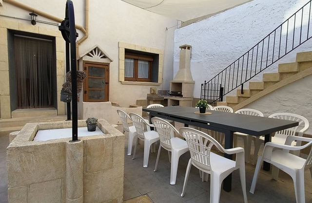 Village house with patio and barbecue