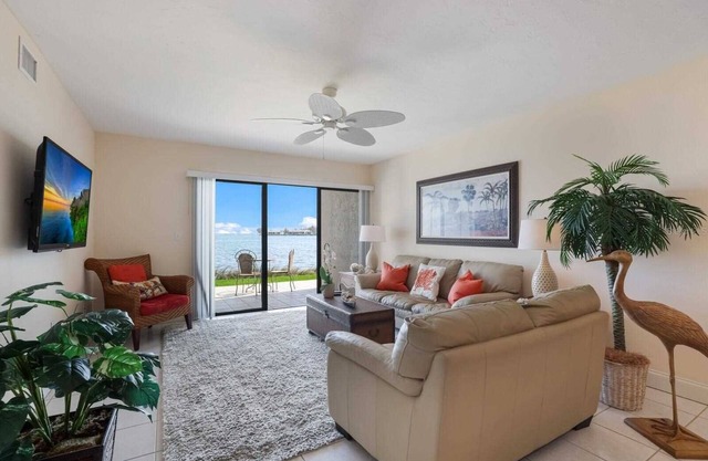 Watch dolphins & pelicans from this 2 bedroom/2 bath waterfront condo.