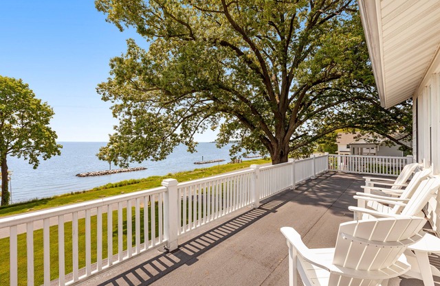 Waterfront home with scenic porches, yard, grill, jetted tub, central AC, & W/D