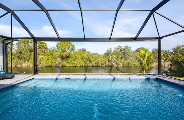 Waterfront Key West Style Home with Heated Pool Located in South Gulf Cove