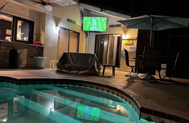 Waterfront Lake Tarpon Home with heated salt water pool, fitness room, WiFi