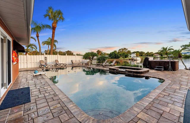 Waterfront Oasis w/Pool, Spa, Boat & Jet ski Dock, Game Room & Outdoor Kitchen
