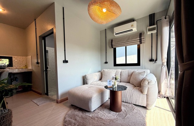 You will Enjoy a Stylish Stay with 4K Curved Monitor, Cozy Couch & Central Spot