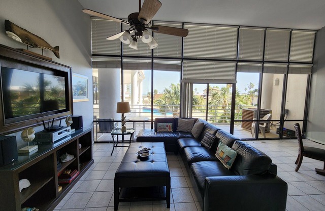 Your Own Island Paradise in this very spacious condo with elevated ceilings!