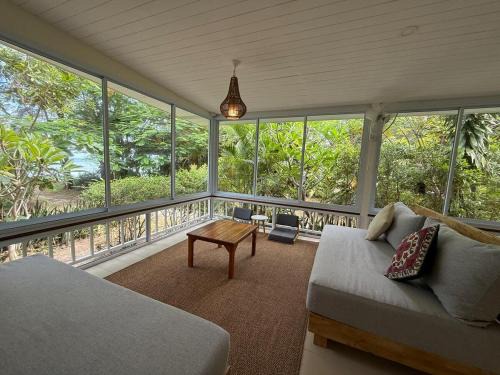 Zen Beach Oasis - Balinese Beachfront House with Stunning Sea View