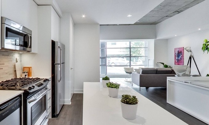 Wellington Place Condo | 100% Walk Score! NEW Large, High Ceilings, Designer Luxury Open Style Live/Work!