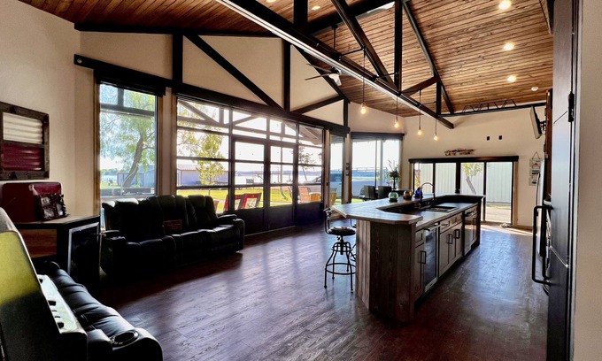 Graford House | 2 bed, 2 bath barndominium with pickle ball court, patio, & dock