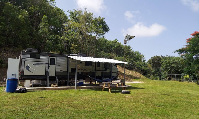 Aguadilla House | 2 bedroom camper, minutes from Aguadilla & Isabela beaches with AC and comfort.