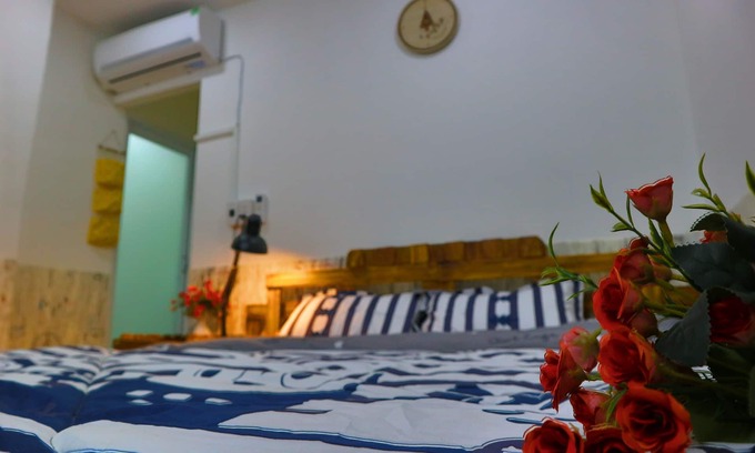 District 3 House | 201 - Small room with big window
