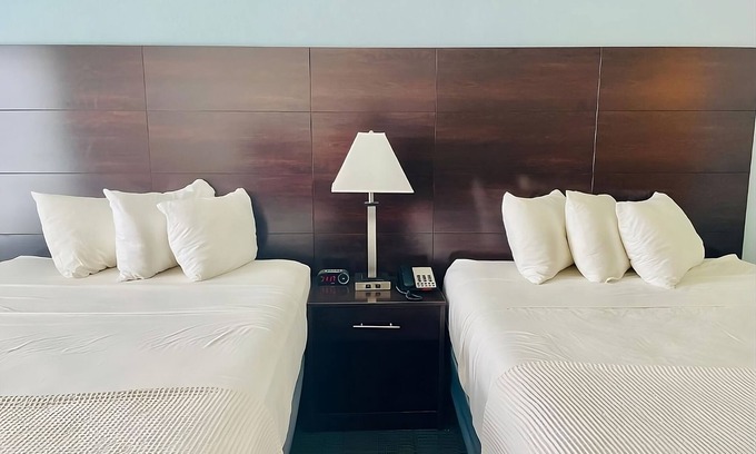 Cuero House | 3 Double Queen With Kitchenette at FairBridge Inn & Suites Cuero, Pet-Friendly!