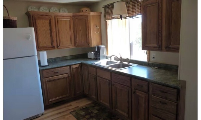 Markville House | 4-bedroom north woods, pet friendly cabin with WiFi, great room and fire place.