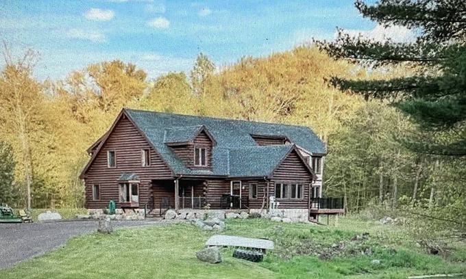 Amery Cabin | 6000 sqft Log Cabin - Nestled on 53 acres -ski out access. 10 min from the lake!