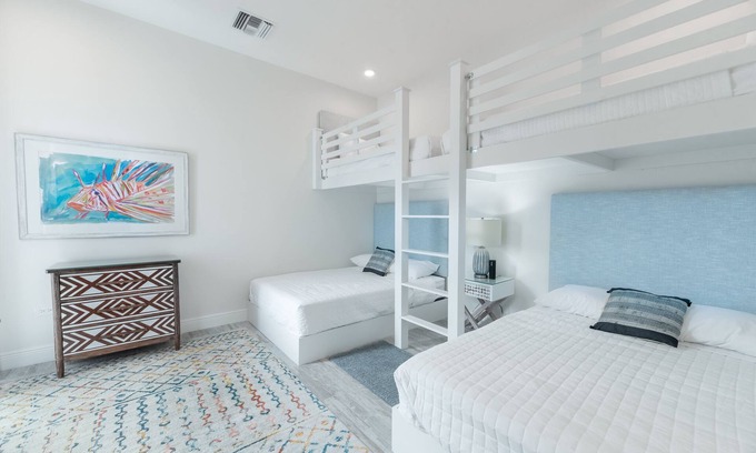 West Bay Condo | 7 Mile Beach Beach Club and Pool Pavilion. Ocean views from Roof Terrace