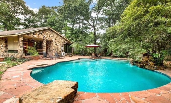 Tomball Cottage | 8 acres of fun & relaxation in a beautiful Rock Cottage with a pool and hot tub