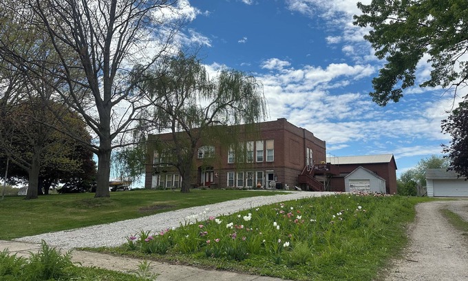 Oskaloosa Apartment | A Class-y & spacious 1500 square foot retreat in a century old brick schoolhouse