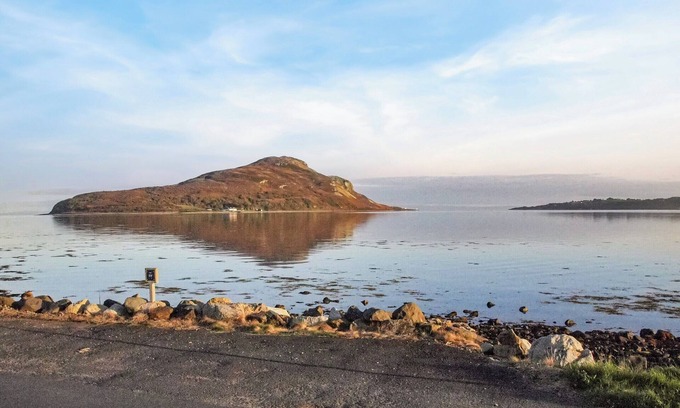 Isle of Arran Cottage | A fantastic family home situated on the seashore with stunning views over Lamlash Bay to Holy Isle.
