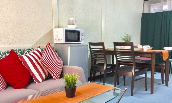 Higashinari Apartment | a room with two toilets and a shower