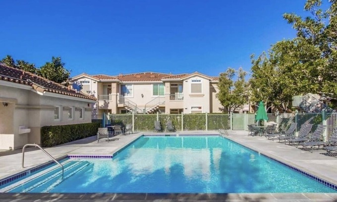 Sabre Springs Condo | A room wt a queen bed and room with 2 twin beds; an attached,interior bathroom.