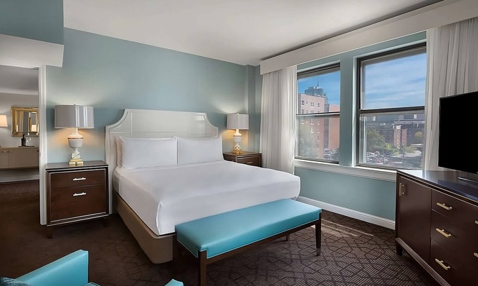 Central West End Hotel | A short drive away from Saint Louis Science Center! W/Pool, Parking & Cinema!