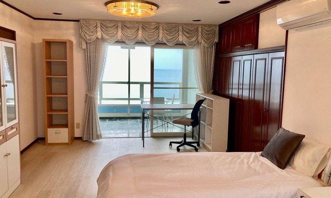 Hamada House | A triple room with a spectacular oceanfront view sunset right in front of you and plenty of amenit/Hamada Shimane