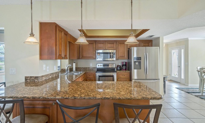 Pebble Beach House | ABSOLUTELY GORGEOUS CANAL HOME WITH HEATED INGROUND POOL ON A QUIET STREET!