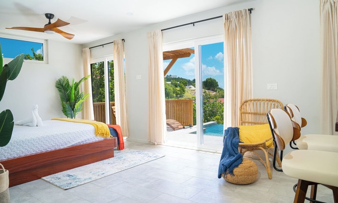 Osbourn Cottage | Affordable luxury, with runway views and tropical breeze.