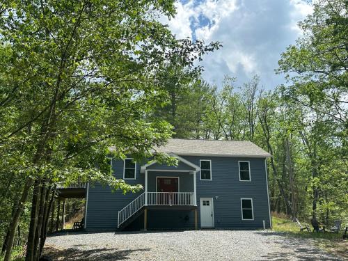 Great Cacapon House | All Decked Up - wifi, view, river access, fire pit, 3 bedrooms, games, family friendly