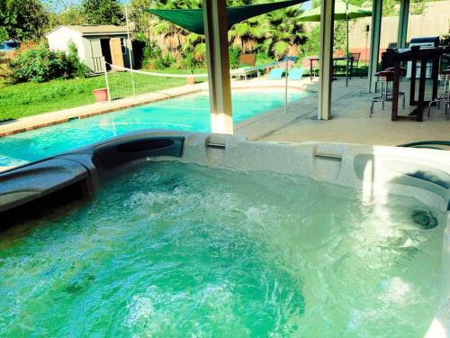 Pflugerville House | Amazing House with Pool, Arcade, Hot Tub and More - Accomodates 16 guests
