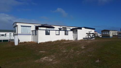 Ballum House | AMELAND - Ballum: Stacaravan Chalet (incl. fietsen) bij strand en zee