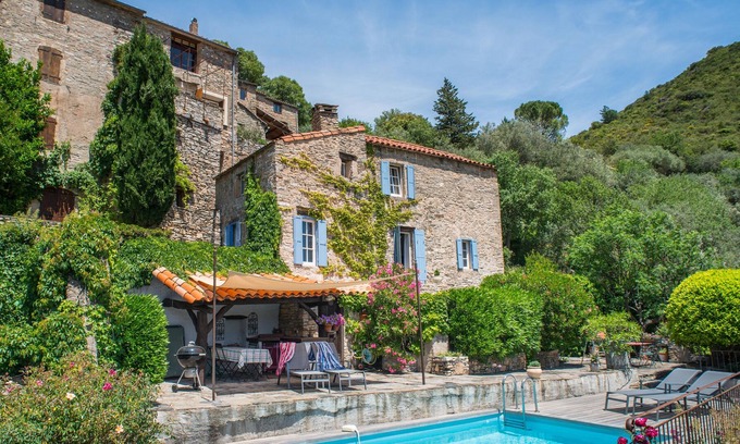 Vieussan Cottage | An authentic stone house, pool, beautiful garden and stunning views