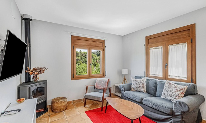 Sant Quirze Safaja Apartment | Apartment 'Cal Ton' with Mountain View, Shared Garden and Air Conditioning