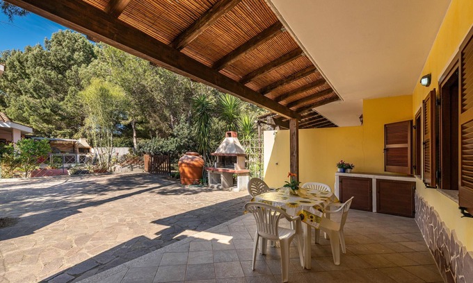 Porto Pino House | Apartment 'Oasi Blu Porto Pino' with Terrace, Garden & Wi-Fi