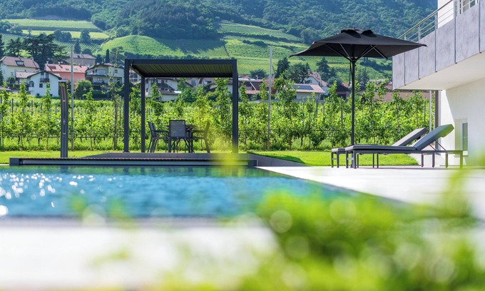 Tramin Apartment | Apartment Zwerger 'Südost' with balcony, pool and large sunbathing lawn
