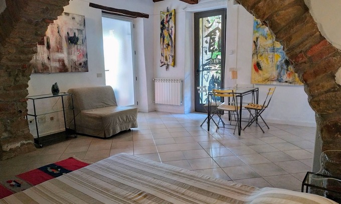 Scarlino Apartment | Artist's House Plus, sea view garden and original artwork.