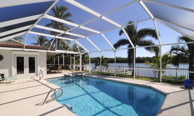 Port Canaveral House | Banana River Beauty-Five bedroom waterfront home with heated pool and spa