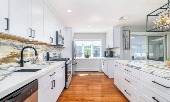 Baldwin Harbor House | Bayfront Brand New Reno with Hot Tub, Pool & Beach