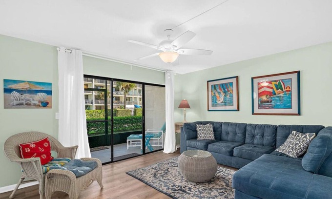 Port Canaveral Condo | Beach 50 feet from back patio door with Pool and Hot Tub!