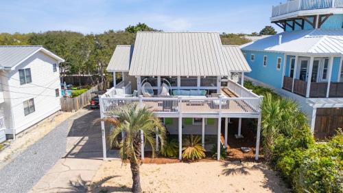 Seacrest House | Beach Retreat w Sundeck Golf Cart Bikes Bungalow House by AvantStay