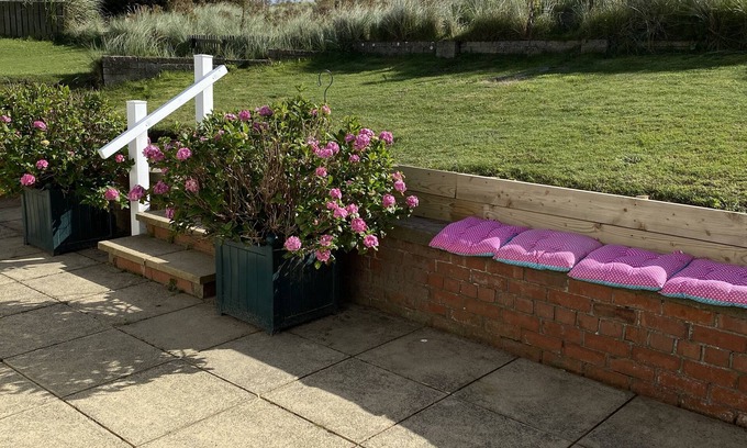 Beadnell House | Beadnell Fantastic Bungalow - garden backs straight onto dunes and beach.