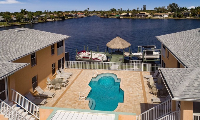 Pelican Apartment | Beautiful 4 unit building on Lake Louise with a private pool.