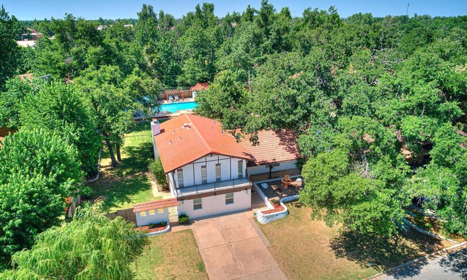 Central Oklahoma City House | Beautiful home with large outdoor pool and hot tub. Large beautiful backyard
