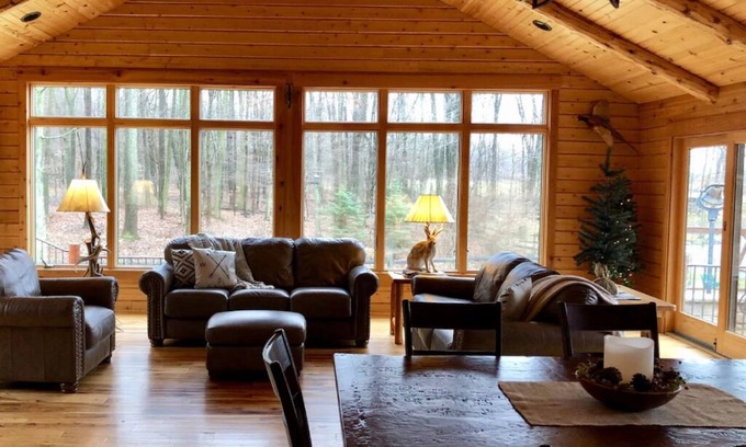 Dundee Cabin | Beautiful Log Cabin nestled in the woods of Amish Country. Relax in our hot tub!